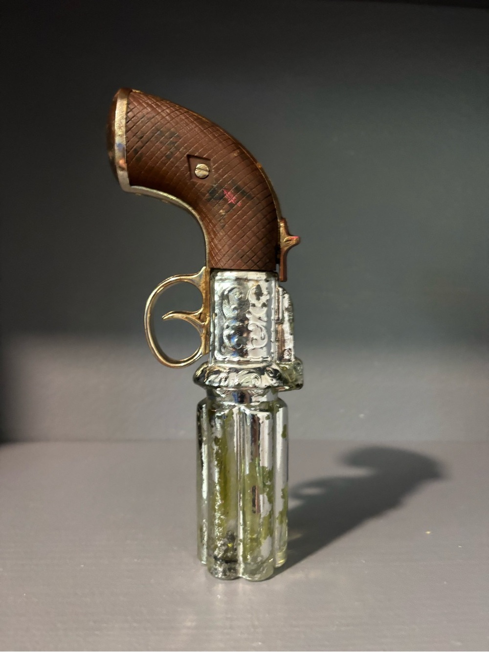 Avon Pistol-Shaped Bottle in Brown and Silver